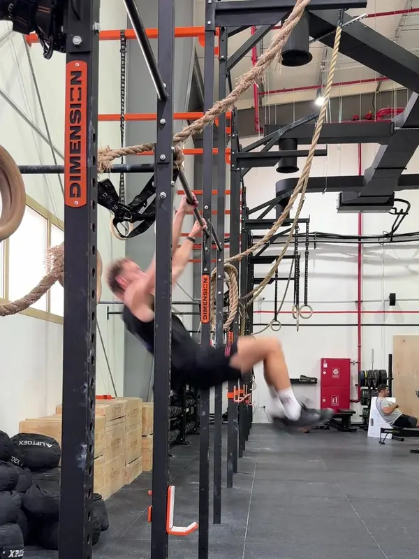 Tom kicking forward out of the arch with his arms straight