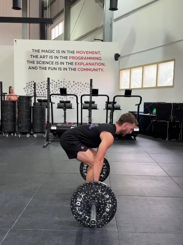 Tom set up for the clean, shoulders over the bar
