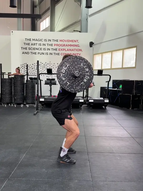 Tom catching the clean in the front rack, knees bent