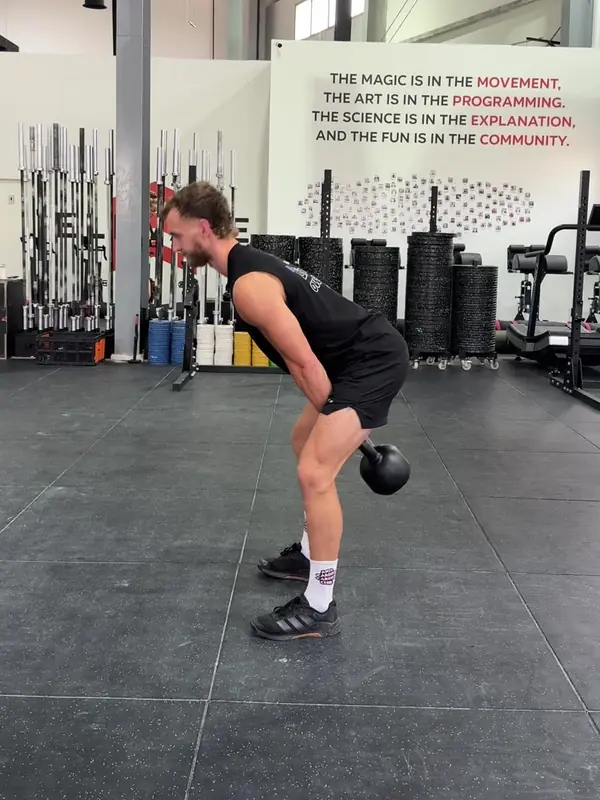 Tom in the backswing, bell between his thighs