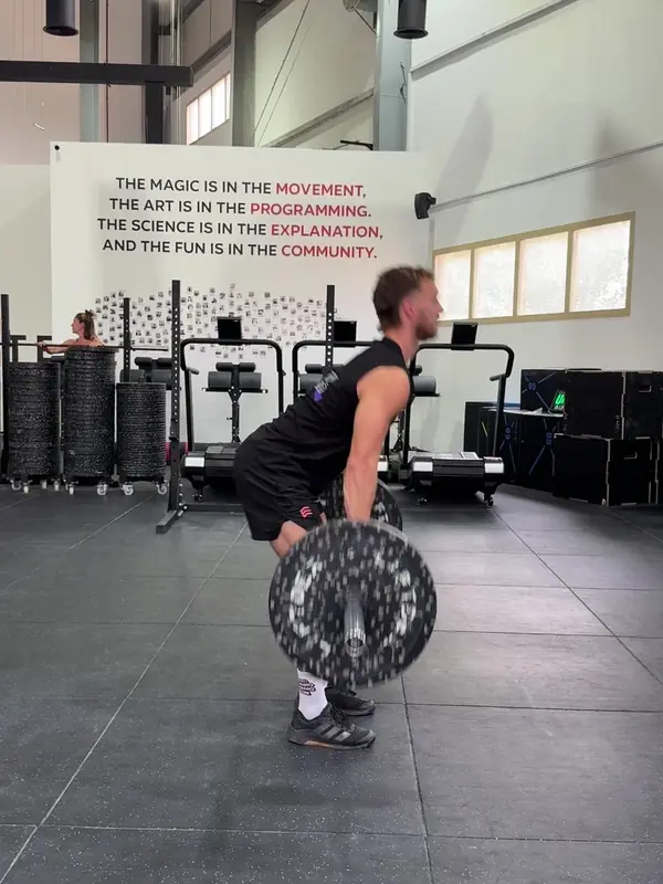 Tom with the bar just past his knees in the first pull