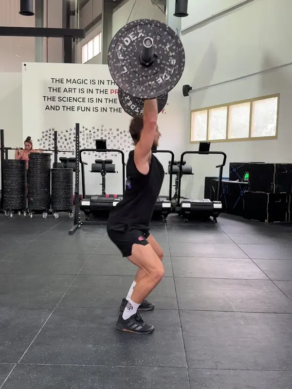 Tom catching the jerk with locked arms and bent knees