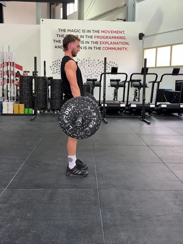 Tom standing tall at the top of the deadlift