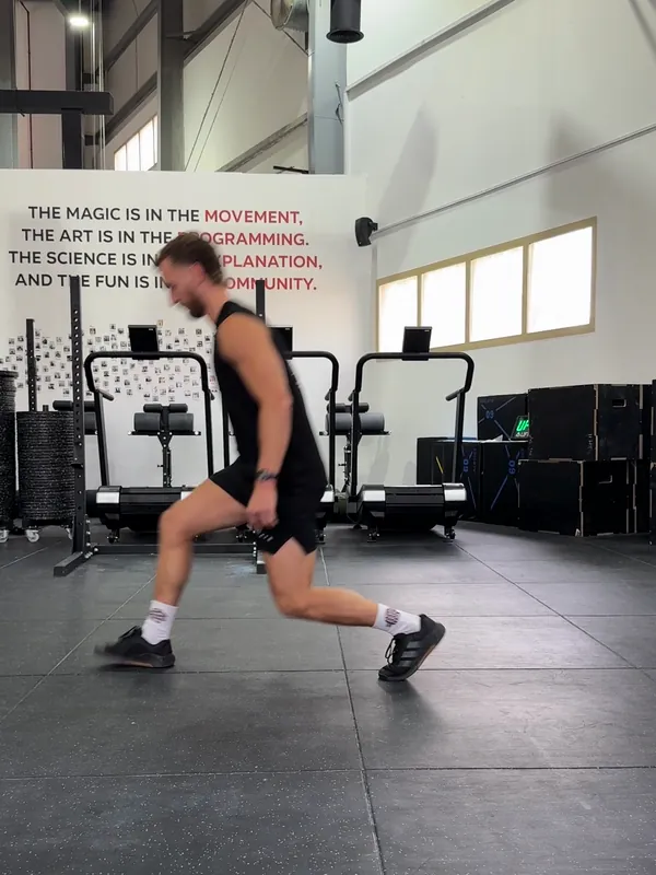 Coach Tom planting his front foot after a long step forward into a lunge