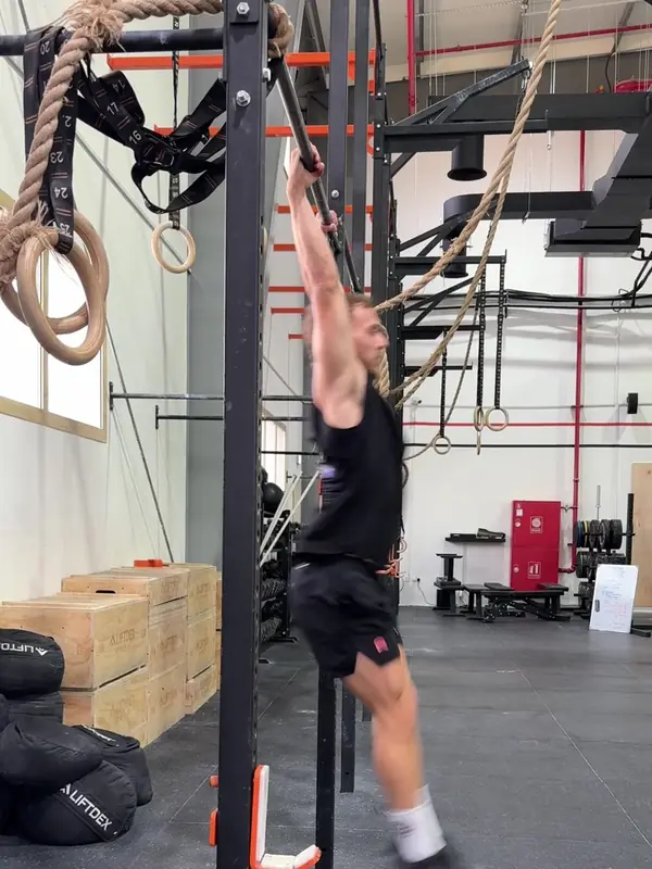 Tom swinging back down to start the next rep